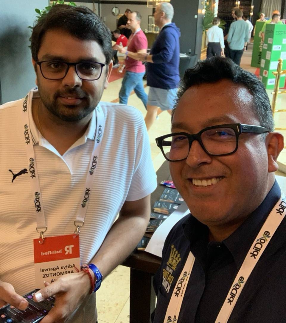 Aditya Agarwal meeting a partner on the conference exhibition floor